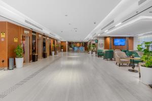 an empty lobby of a hospital with chairs and tables at Grand Plaza Al Madina in Medina