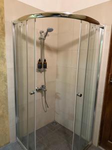 a shower with a shower head in a bathroom at Aayu Lagoon in Negombo +59 photos
