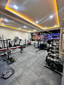 a gym with a lot of equipment in a room at Vilasa stays and colive in Hyderabad