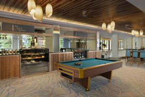 a billiard room with a pool table and a bar at Courtyard by Marriott Bali Nusa Dua Resort in Nusa Dua