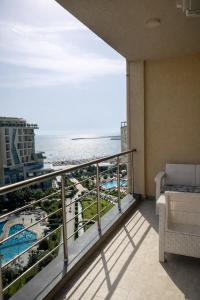 a balcony with a view of the beach and the ocean at Mare Nostrum Residence in Shëngjin