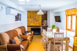 a living room with a couch and a table at Casa Corralazos in Castril