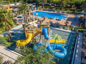 an aerial view of a water park with a water slide at glamping bravatents in Blanes +13 photos