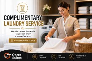 a woman standing in a laundry room holding a basket at OPERA SUITES Apart Hotel in Antalya