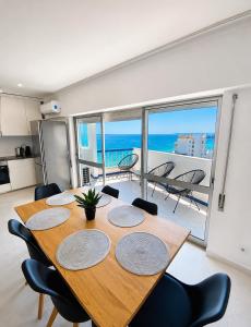 a dining room with a table and a view of the ocean at Concorde Luxury Ocean View in Portimão
