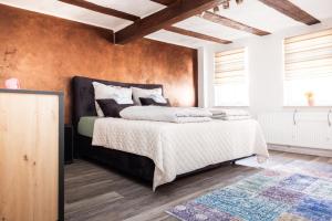 a bedroom with a large bed in a room at Mediterran Apartments-Cabernet Sauvignon in Fulda