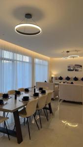 a dining room with a table and some chairs at منتجع دار DAR Resort in Hail