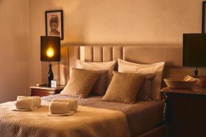 a bedroom with a large bed with white sheets and pillows at Douro Panorama Valley in Pinhão