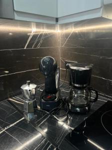 a coffee maker on a counter in a kitchen at BENILOVE en playa VUE MER Panoramique in Benidorm +20 photos