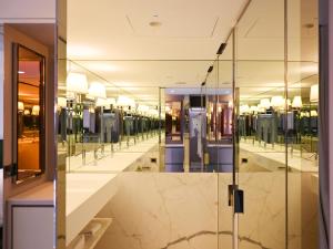 a dressing room with a row of mirrors at OOD Hotel Taipei DunhuaNorth in Taipei +71 photos