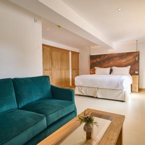 a living room with a couch and a bed at The Angel at Hetton in Hetton