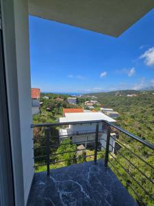 a balcony with a view of a building at Brita Apartman in Utjeha