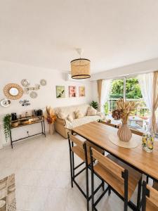 a living room with a table and a couch at Le Saint Michel - MENTON#MONACO - 6 PERSONS - Parking- bord de mer in Menton