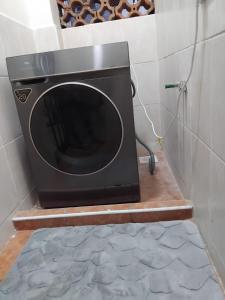 a microwave oven sitting on a wooden table at Achievers stays in Kitengela 