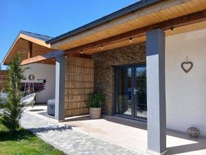 a detached house with a wooden roof at Popa Cabana in Sibiu