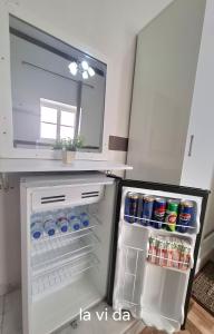 an open refrigerator with drinks in it in a kitchen at Lavida ve lv et in Cairo +31 photos