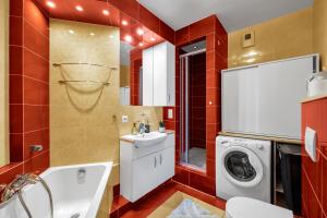 a bathroom with a sink and a washing machine at Spacious 3Rooms Apt with Balcony Parking in Warsaw +15 photos