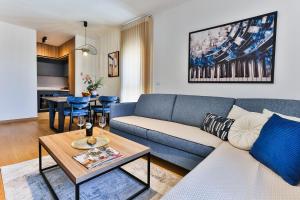 a living room with a couch and a table at Numa by Kraft in Podgorica