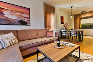 a living room with a couch and a table at Numa by Kraft in Podgorica