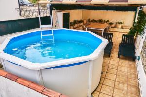 a large hot tub sitting on top of a patio at Douro Panorama Valley in Pinhão