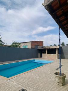 a large swimming pool with a swing at Chácara do Neno in Limeira