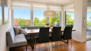 a dining room with a table and chairs at Bodensee Loft in Daisendorf