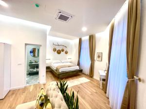 a bedroom with a bed and a mirror at Biosphere Lux Apartments in Sarajevo