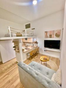 a living room with a couch and a desk at Biosphere Lux Apartments in Sarajevo