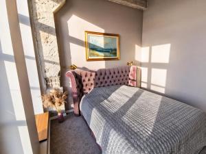 a bedroom with a bed in a room at Tamula Lake View Apartment in Võru