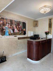 a lobby with a painting of a group of people at Готель-ресторан Октан in Holovanivs'k +37 photos