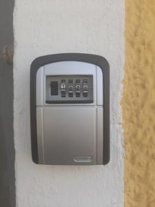 a soap dispenser on the side of a wall at Strandhgarden B&B Cozy Room near Malmo in Oxie