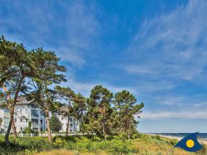 a house on a hill next to the beach at Villa Strandperle Whg 07 in Bansin