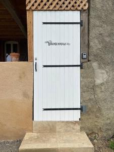 a white door with the word blazes written on it at Appartement indépendant in Aux-Aussat +8 photos