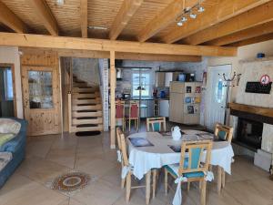 a kitchen and living room with a table and chairs at Ferienhaus Concordiasee in Friedrichsaue