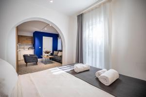 a bedroom with a large bed with two pillows at Noa Suite Hotel Only Adult in Bodrum City +86 photos