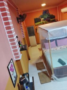 a room with a small bed in a house at Sigiri Fortress View lodge in Sigiriya
