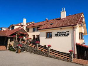 a building with a sign that reads reunion hotel at Penzión Hoffer in Nitra