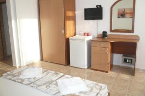 a bathroom with a sink and a washer and dryer at Къща за гости Мишел in Nesebar +34 photos