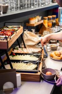 a buffet line with food on a table at HOTEL andrä in Salzburg