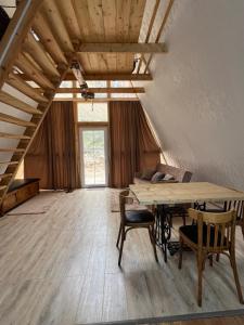 a large room with a wooden table and chairs at Metsadzor Resort, Areni in Areni