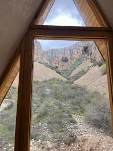 a window view of a mountain view from a house at Metsadzor Resort, Areni in Areni +4 photos