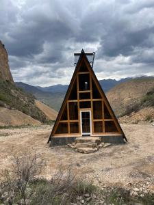 a frame cabin in the middle of a mountain at Metsadzor Resort, Areni in Areni