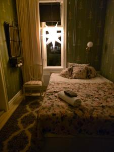 a bedroom with a bed and a window at Nordgrenska in Åmål +1 photo