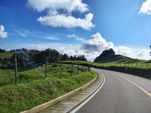 an empty road in the middle of a field at Hostal Perla Del Norte in Murillo