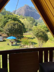 a view of a mountain from the inside of a tent at Abrigo Pedrão in Pedralva +12 photos