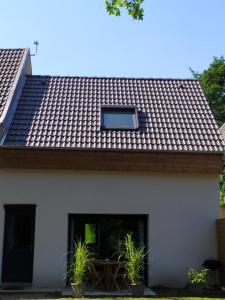a roof of a house with a window on it at Calme et Volupté in Maxilly-sur-Saône