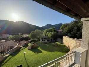 a view of a garden from a balcony at Villa Olbia mare in Olbia