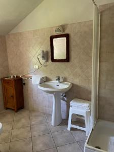 a bathroom with a sink and a mirror at Agriturismo S.Lucia in Roccaforte Mondovì