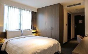 Postelja oz. postelje v sobi nastanitve Wonstar Hotel