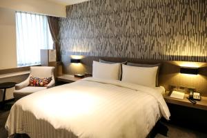 Postelja oz. postelje v sobi nastanitve Wonstar Hotel